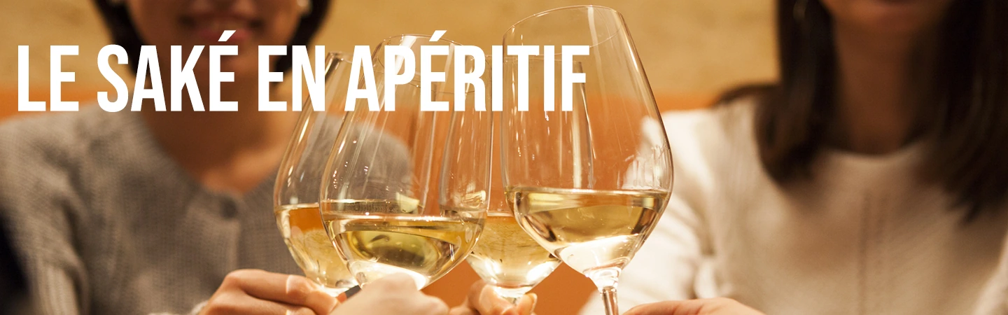 people clinking wine glasses filled with text that reads “sake as an aperitif”
